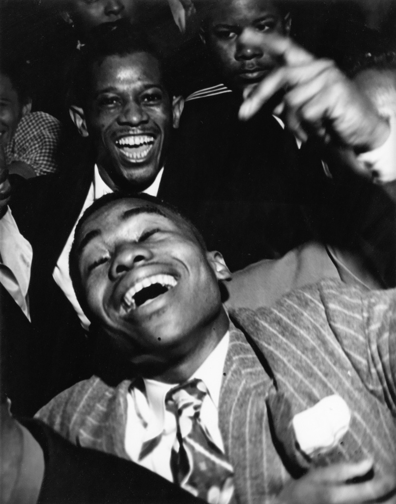 WEEGEE [ARTHUR FELLIG] (1899-1968) African American men in a club.